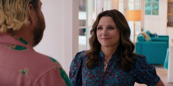 Movie still from “You People” (2023), directed by Kenya Barris – A person standing next to another person; Close Up shot, Over the shoulder angle