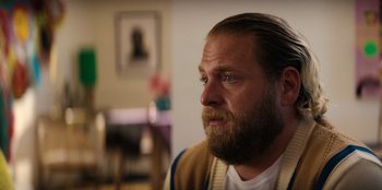 Movie still from “You People” (2023), directed by Kenya Barris – A person with a beard; Close Up shot, Over the shoulder angle