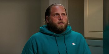 Movie still from “You People” (2023), directed by Kenya Barris – A man with a beard wearing a blue hoodie; Close Up shot, Over the shoulder angle