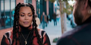 Movie still from “You People” (2023), directed by Kenya Barris – A person with long braids; Close Up shot, Over the shoulder angle