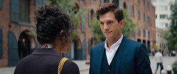 Movie still from “Your Place or Mine” (2023), directed by Aline Brosh McKenna – A man in a blue suit talking to a woman in a white shirt; Close Up shot, Over the shoulder angle