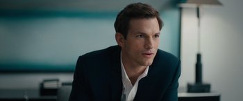 Movie still from “Your Place or Mine” (2023), directed by Aline Brosh McKenna – A person wearing a suit and tie; Close Up shot, Over the shoulder angle