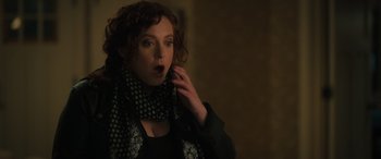 Movie still from “Your Place or Mine” (2023), directed by Aline Brosh McKenna – A woman in a black shirt and a black and white polka dot scarf; Close Up shot, Over the shoulder angle