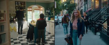 Movie still from “Your Place or Mine” (2023), directed by Aline Brosh McKenna – A woman walking down the street while a child stands in a kitchen; Wide shot, Low angle