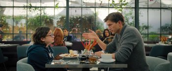 Movie still from “Your Place or Mine” (2023), directed by Aline Brosh McKenna – A man and a woman are sitting at a table; Medium shot, Over the shoulder angle