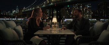 Movie still from “Your Place or Mine” (2023), directed by Aline Brosh McKenna – A man and a woman sitting at a dinner table; Medium shot, Over the shoulder angle