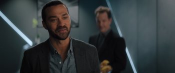 Movie still from “Your Place or Mine” (2023), directed by Aline Brosh McKenna – A man in a suit and tie standing next to another man in a suit and tie; Close Up shot, Over the shoulder angle