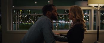 Movie still from “Your Place or Mine” (2023), directed by Aline Brosh McKenna – A man and a woman sitting in front of each other; Medium shot, Over the shoulder angle