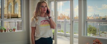 Movie still from “Your Place or Mine” (2023), directed by Aline Brosh McKenna – A beautiful young lady talking on a cell phone; Medium shot, Over the shoulder angle