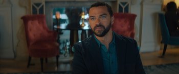 Movie still from “Your Place or Mine” (2023), directed by Aline Brosh McKenna – A person wearing a suit and tie; Close Up shot, Over the shoulder angle