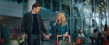 Movie still from “Your Place or Mine” (2023), directed by Aline Brosh McKenna – A man and a woman holding hands while standing next to each other; Medium shot, Over the shoulder angle