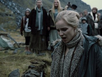 Movie still from “Zack Snyder's Justice League” (2021), directed by Zack Snyder – A group of people standing in a field with a woman; Medium shot, Low angle