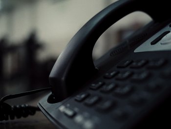 Movie still from “Zack Snyder's Justice League” (2021), directed by Zack Snyder – A black telephone on a table; Extreme Close Up shot, High angle
