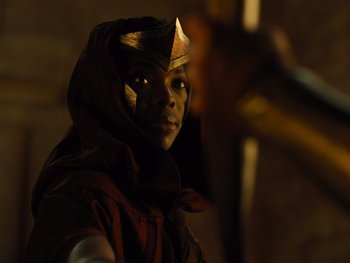 Movie still from “Zack Snyder's Justice League” (2021), directed by Zack Snyder – A person wearing a red and gold costume; Close Up shot, Over the shoulder angle