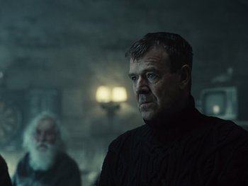 Movie still from “Zack Snyder's Justice League” (2021), directed by Zack Snyder – A man wearing a black sweater looking at the camera; Close Up shot, Over the shoulder angle