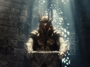 Movie still from “Zack Snyder's Justice League” (2021), directed by Zack Snyder – A man in a costume sitting in a chair in the middle of a forest; Wide shot, Over the shoulder angle