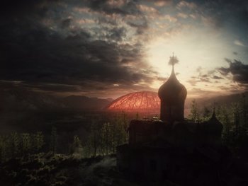 Movie still from “Zack Snyder's Justice League” (2021), directed by Zack Snyder – The sun is setting over a church in the middle of a valley; Extreme Wide shot, Low angle