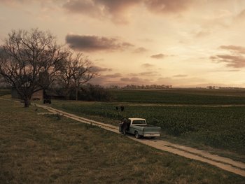 Movie still from “Zack Snyder's Justice League” (2021), directed by Zack Snyder – A truck parked on the side of a road near a field; Extreme Wide shot, High angle