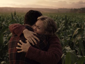 Movie still from “Zack Snyder's Justice League” (2021), directed by Zack Snyder – Two people hugging in a field of corn at sunset; Medium shot, Over the shoulder angle