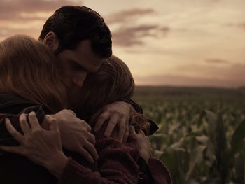 Movie still from “Zack Snyder's Justice League” (2021), directed by Zack Snyder – A man and a woman hugging in a field; Close Up shot, Over the shoulder angle
