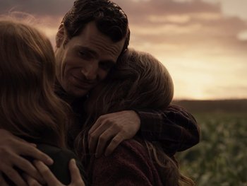 Movie still from “Zack Snyder's Justice League” (2021), directed by Zack Snyder – A man and a woman hugging in a field at sunset; Close Up shot, Over the shoulder angle