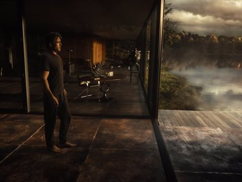 Movie still from “Zack Snyder's Justice League” (2021), directed by Zack Snyder – A man standing in front of a large glass window; Wide shot, High angle