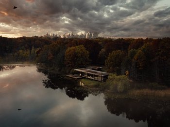 An aerial view of a body of water with a building in the middle of it