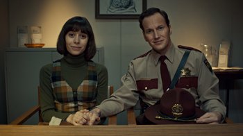 Movie still from “Fargo” (2014), created by Noah Hawley – A man and a woman sitting at a wooden table; Medium shot, Over the shoulder angle
