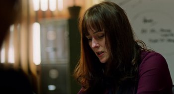 Movie still from “Zero Dark Thirty” (2012), directed by Kathryn Bigelow – A person with long brown hair; Close Up shot, Over the shoulder angle