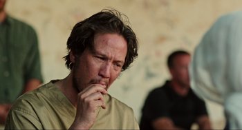 Movie still from “Zero Dark Thirty” (2012), directed by Kathryn Bigelow – A person with his hand to his face; Close Up shot, Over the shoulder angle