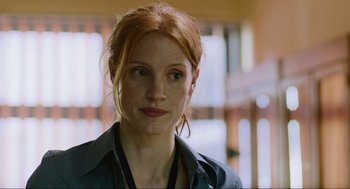 Movie still from “Zero Dark Thirty” (2012), directed by Kathryn Bigelow – A person wearing a black shirt; Close Up shot, Over the shoulder angle