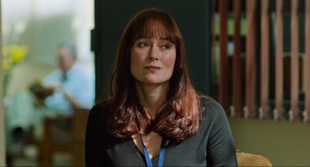 Movie still from “Zero Dark Thirty” (2012), directed by Kathryn Bigelow – A person with long hair; Close Up shot, Over the shoulder angle