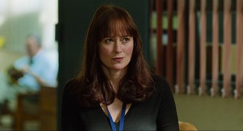 Movie still from “Zero Dark Thirty” (2012), directed by Kathryn Bigelow – A person with long hair; Close Up shot, Over the shoulder angle