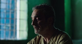 Movie still from “Zero Dark Thirty” (2012), directed by Kathryn Bigelow – A person wearing a yellow shirt; Close Up shot, Low angle