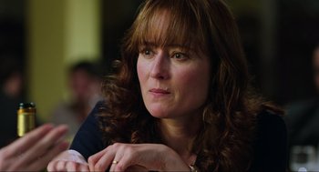 Movie still from “Zero Dark Thirty” (2012), directed by Kathryn Bigelow – A person with long brown hair; Close Up shot, Over the shoulder angle