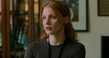 Movie still from “Zero Dark Thirty” (2012), directed by Kathryn Bigelow – A person with long red hair; Close Up shot, Over the shoulder angle