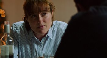 Movie still from “Zero Dark Thirty” (2012), directed by Kathryn Bigelow – A woman sitting in front of another person; Close Up shot, Over the shoulder angle