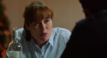 Movie still from “Zero Dark Thirty” (2012), directed by Kathryn Bigelow – A woman sitting in front of another person; Close Up shot, Over the shoulder angle