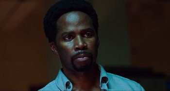 Movie still from “Zero Dark Thirty” (2012), directed by Kathryn Bigelow – A person wearing a shirt; Close Up shot, Low angle