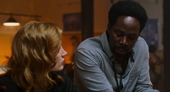 Movie still from “Zero Dark Thirty” (2012), directed by Kathryn Bigelow – A man and a woman talking to each other; Close Up shot, Over the shoulder angle