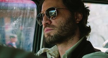 Movie still from “Zero Dark Thirty” (2012), directed by Kathryn Bigelow – A person wearing sunglasses; Close Up shot, Low angle