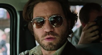 Movie still from “Zero Dark Thirty” (2012), directed by Kathryn Bigelow – A person wearing sunglasses; Close Up shot, Low angle