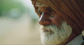 Movie still from “Zero Dark Thirty” (2012), directed by Kathryn Bigelow – An old man with a long beard and a turban; Extreme Close Up shot, Low angle