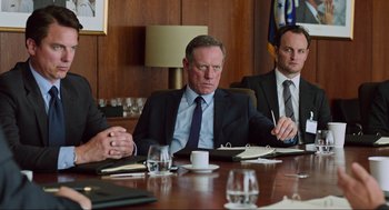 Movie still from “Zero Dark Thirty” (2012), directed by Kathryn Bigelow – Three men in suits sitting at a conference table; Medium shot, Over the shoulder angle