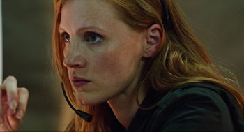 Movie still from “Zero Dark Thirty” (2012), directed by Kathryn Bigelow – A person wearing a headset; Close Up shot, Low angle