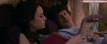 Movie still from “Zombieland: Double Tap” (2019), directed by Ruben Fleischer – A man and a woman laying on a bed; Close Up shot, Over the shoulder angle