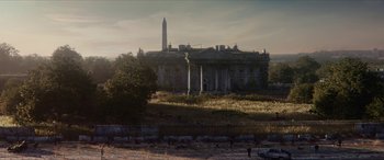 Movie still from “Zombieland: Double Tap” (2019), directed by Ruben Fleischer – An old building with a statue in front of it; Extreme Wide shot, Low angle