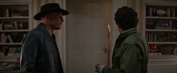 Movie still from “Zombieland: Double Tap” (2019), directed by Ruben Fleischer – Two people standing in front of a door; Medium shot, Over the shoulder angle