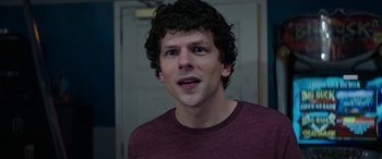 Movie still from “Zombieland: Double Tap” (2019), directed by Ruben Fleischer – A person with curly black hair; Close Up shot, Over the shoulder angle