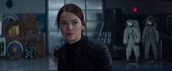 Movie still from “Zombieland: Double Tap” (2019), directed by Ruben Fleischer – A person wearing a leather jacket; Close Up shot, Over the shoulder angle